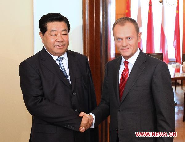 Jia Qinglin (L), chairman of the Chinese People's Political Consultative Conference (CPPCC) National Committee, meets with Polish Prime Minister Donald Tusk in Warsaw, Poland, Nov. 3, 2010. [Ding Lin/Xinhua]