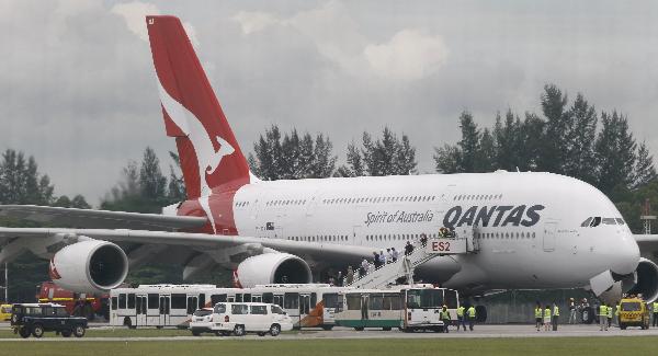 A Qantas Airways 380 passenger plane flight QF32 is sprayed by rescue services after making an emergency landing at Changi airport in Singapore November 4, 2010. [Xinhua]