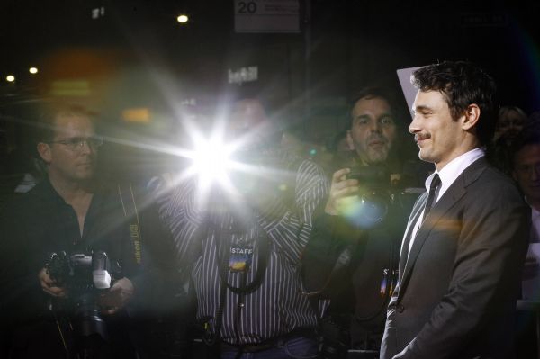 Franco poses at the premiere of '127 Hours' at the Samuel Goldwyn theatre in Beverly Hills Cast member James Franco poses at the premiere of '127 Hours' at the Samuel Goldwyn theatre in Beverly Hills, California November 3, 2010. The movie opens in the U.S. on November November 5. (Xinhua/Reuters)