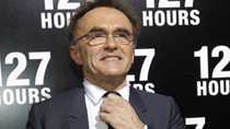 Director of the movie '127 Hours' Danny Boyle adjusts his tie as he poses at its premiere at Samuel Goldwyn theatre in Beverly Hills, California November 3, 2010.