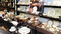 A visitor looks at exhibits at a homeware exhibition organised by Waterford Wedgwood Royal Doulton in Hong Kong, south China, Nov. 4, 2010.