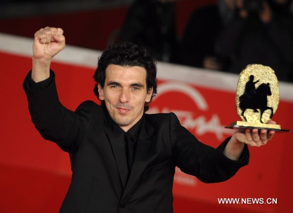 Olias Barco, director of the black comedy 'Kill Me Please', poses on the red carpet after receiving the Marc' Aurelio Jury Award for Best Film Award, during the 5th Rome Film Festival, in Rome, Italy, Nov. 5, 2010. (Xinhua/Wang Qingqin) 