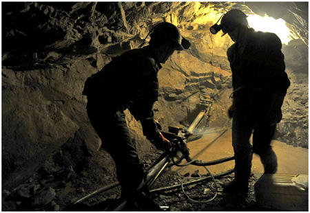 Miners prepare explosives near the city of Yuncheng in Shanxi Province on July 23.