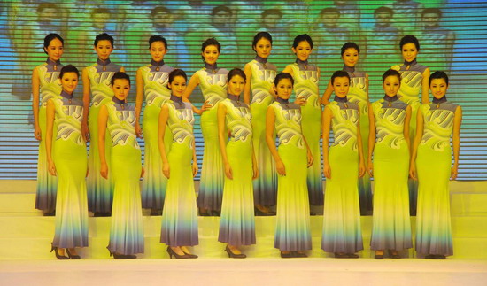 Models present the staff uniforms for the 2010 Asian Games in Guangzhou, South China&apos;s Guangdong province, on Sunday Nov 7, 2010. The pictured series is themed &apos;Xingyun Liushui,&apos; or &apos;Floating Clouds and Flowing Water&apos;. [Xinhua]