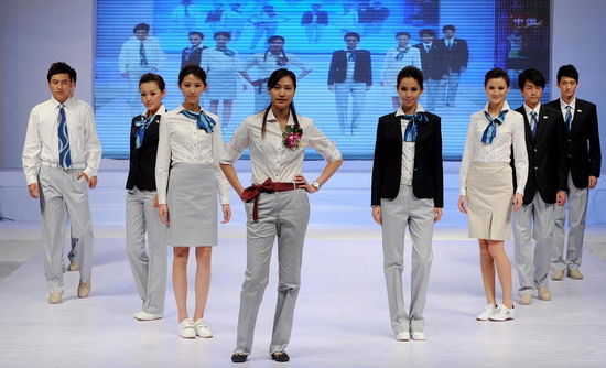 Models present the staff uniforms for the 2010 Asian Games in Guangzhou, South China&apos;s Guangdong province, on Sunday Nov 7, 2010. [Xinhua]