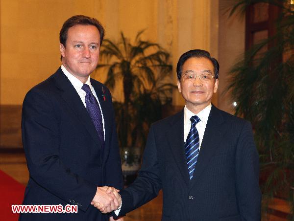 Chinese Premier Wen Jiabao (R) shakes hands with British Prime Minister David Cameron in Beijing, capital of China, Nov. 9, 2010. [Yao Dawei/Xinhua]