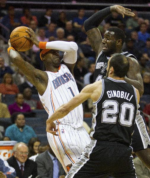 Charlotte Bobcats shooting guard Stephen Jackson (1) works to hold onto the ball against San Antonio Spurs forward DeJuan Blair (45) and shooting guard Manu Ginobili (20) during an NBA basketball game in Charlotte, North Carolina on November 8, 2010. (Xinhua/Reuters Photo) 