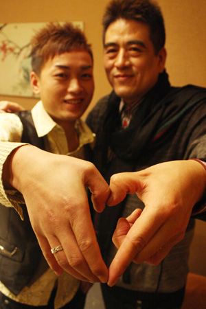 Zeng Ge, 47, and Xiao Pan, 27, marry in a bar in Chengdu on January 3. 