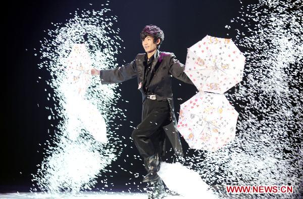 A Chinese magician performs during the Hangzhou International Magic Convention in Hangzhou, capital of east China&apos;s Zhejiang Province, Nov. 9, 2010. More than 100 magicians from 19 countries and regions attended the 7-day-long magic convention, which kicked off Tuesday. [Xinhua] 