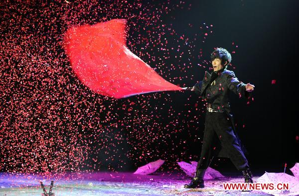 A Chinese magician performs during the Hangzhou International Magic Convention in Hangzhou, capital of east China&apos;s Zhejiang Province, Nov. 9, 2010. More than 100 magicians from 19 countries and regions attended the 7-day-long magic convention, which kicked off Tuesday. [Xinhua] 