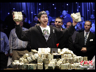 Jonathan Duhamel celebrates winning the World Series of Poker, Monday, Nov. 8, 2010 in Las Vegas. Jonathan Duhamel won the World Series of Poker title and $8.94 million on November 8, 2010, becoming the first Canadian to take down the no-limit Texas Hold 'em main event in Las Vegas. [Chinanews.com]