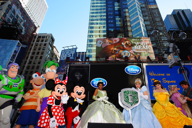 Mickey Mouse and Minnie Mouse pose with other Disney characters during the opening ceremony of the new Time Square Disney Store in New York, Nov 9, 2010. [Xinhua]