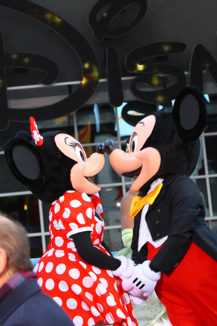 Mickey Mouse and Minnie Mouse pose during the opening ceremony of the new Time Square Disney Store in New York, Nov 9, 2010. [Xinhua]