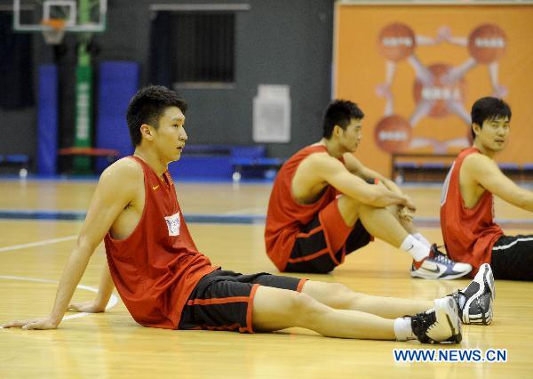 Sun Yue of China's national men's basketball team relaxes on the floor during a training session for the coming Guangzhou Asian Games in Beijing, capital of China, Nov. 9, 2010. (Xinhua/Luo Xiaoguang) 