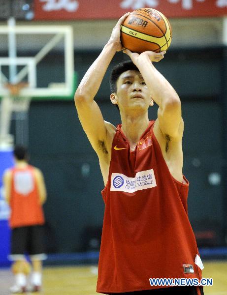 Sun Yue of China's national men's basketball team acts during a training session for the coming Guangzhou Asian Games in Beijing, capital of China, Nov. 9, 2010. (Xinhua/Luo Xiaoguang)
