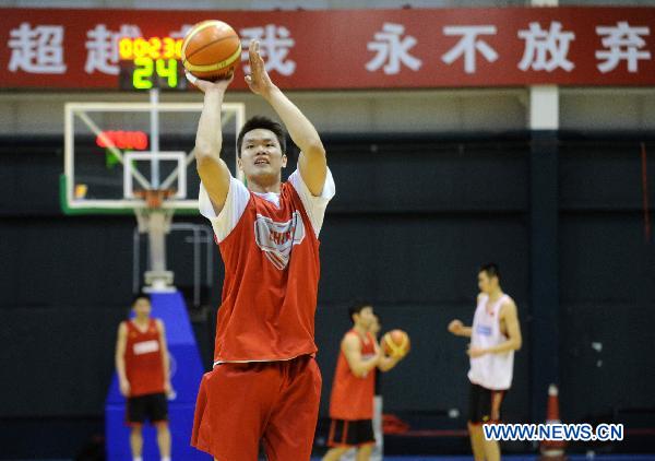 Zhu Fangyu of China's national men's basketball team acts during a training session for the coming Guangzhou Asian Games in Beijing, capital of China, Nov. 9, 2010. (Xinhua/Luo Xiaoguang)