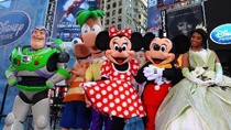 Mickey and Minnie pose with other Disney characters during the opening ceremony of Disney Store Times Square on Times Square in New York, Nov. 9, 2010.