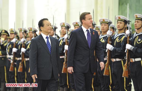 Chinese Premier Wen Jiabao (L) and British Prime Minister David Cameron inspect the guard of honor during a welcoming ceremony Wen holds for Cameron in Beijing, capital of China, Nov. 9, 2010. [Xinhua]