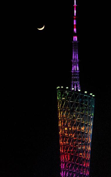 Picture taken on Nov. 10, 2010 shows the crescent and the Guangzhou Tower in Guangzhou, south China&apos;s Guangdong Province. The 16th Asian Games would run in Guangzhou from Nov. 12 to 27. [Xinhua] 