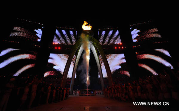 Chinese firework lights up the main cauldron during opening ceremony at the 16th Asian Games at the Haixinsha Island in Guangzhou, China, Nov. 12, 2010. (Xinhua/Chen Xiaowei)