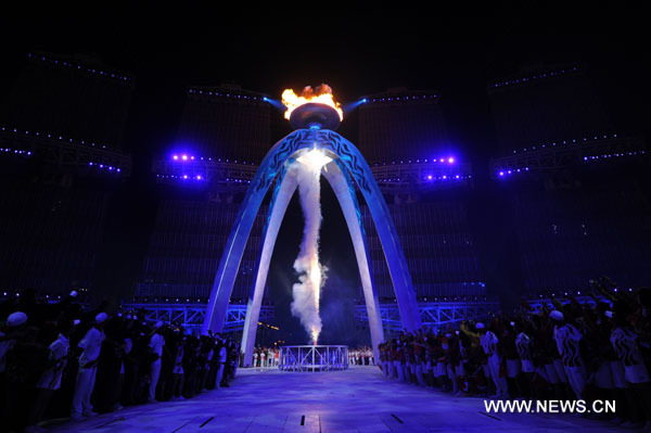 The main cauldron is lit by a Chinese firecracker during the opening ceremony at the 16th Asian Games at the Haixinsha Island in Guangzhou, China, Nov. 12, 2010. (Xinhua/Chen Xiaowei)