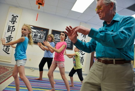 Children practice taiji at the Confucius Institute at the University of Maryland, which offers students a real taste of Chinese culture. [Xinhua photo]