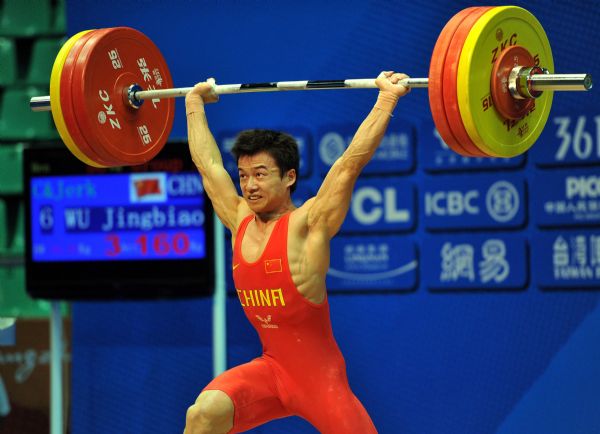 China's Wu Jingbiao competes during the Men's 56kg category competition of Weightlifting at the 16th Asian Games in Dongguan near Guangzhou, capital of south China's Guangdong Province, Nov. 13, 2010. Wu Jingbiao claimed the title with a total of 285kg. (Xinhua/Liu Dawei) 