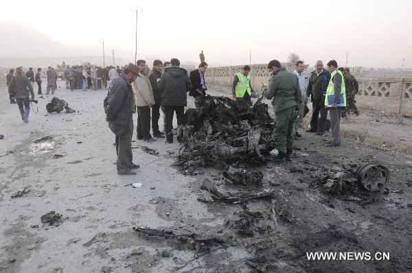 Policemen inspect the site of suicide car bombing in Kabul, capital of Afghanistan, Nov. 12, 2010. [Xinhua/Wang Yan]