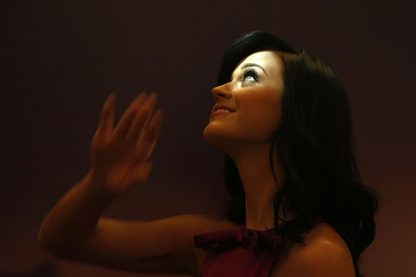 U.S. singer Katy Perry waves during the launch of her fragrance 'Purr' at Selfridges department store on Oxford Street in London November 12, 2010.