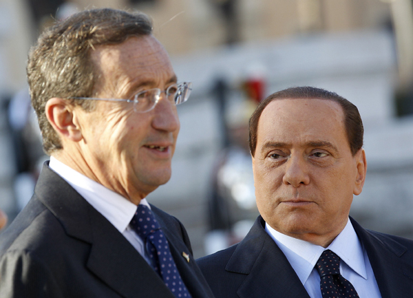 Italian Prime Minister Silvio Berlusconi (R) and Italy's lower house speaker Gianfranco Fini talk as they attend the celebration of the Italian Army's anniversary in Rome November 4, 2010. [Xinhua]
