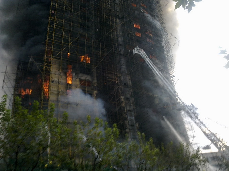 Death toll from the fire in a downtown Shanghai apartment block Monday had risen to 49, said a statement from the municipal publicity department. The 28-story building at the intersection of Jiaozhou Road and Yuyao Road in Jing&apos;an District was being renovated when it caught fire at about 2:15 p.m.. [Sina]