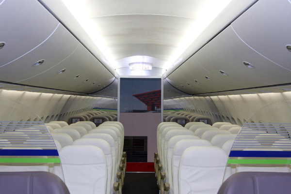 Economy class seats are seen inside a model of the China-made C919 passenger airliner at the 8th China International Aviation and Aerospace Exhibition in Zhuhai, South China&apos;s Guangdong province, Nov 15, 2010. [Xinhua]