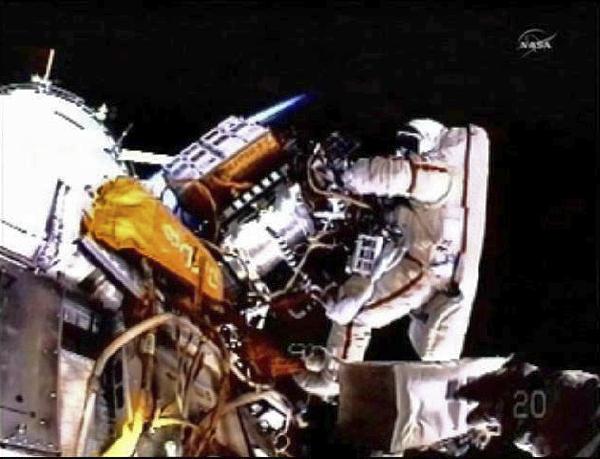 A Russian astronaut wearing Russia's advanced Orlan-MK spacesuits works outside the docking module at the International Space Station (ISS), on Nov. 15, 2010. Two Russian astronauts have started a space walk that would last for at least five hours and 55 minutes on Monday, said the mission control center outside Moscow. [Xinhua]