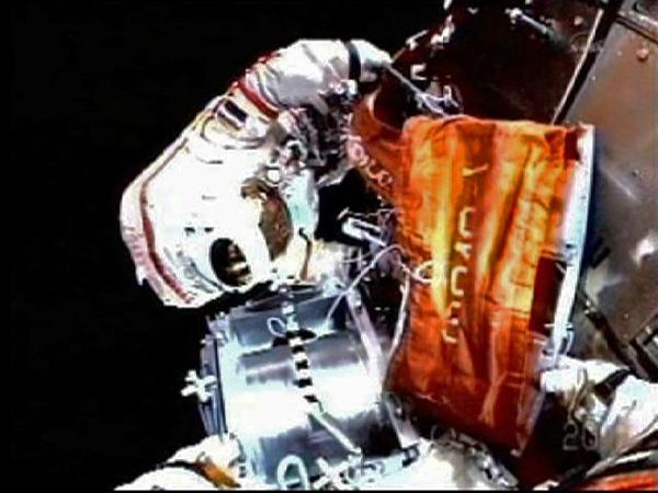 A Russian astronaut wearing Russia's advanced Orlan-MK spacesuits works outside the docking module at the International Space Station (ISS), on Nov. 15, 2010. Two Russian astronauts have started a space walk that would last for at least five hours and 55 minutes on Monday, said the mission control center outside Moscow. [Xinhua]