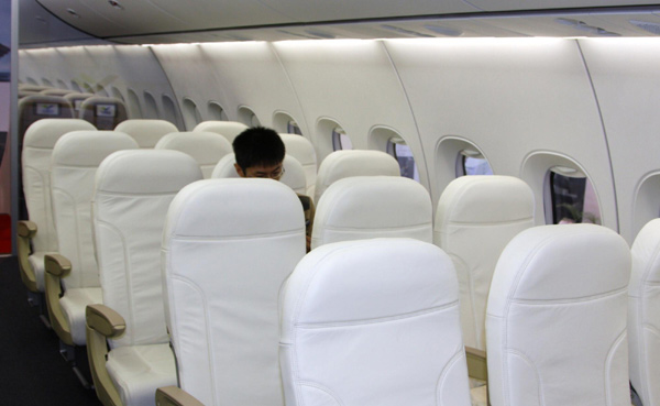 Economy class seats are seen inside a model of the China-made C919 passenger airliner at the 8th China International Aviation and Aerospace Exhibition in Zhuhai, South China's Guangdong province, Nov 15, 2010. [Xinhua]