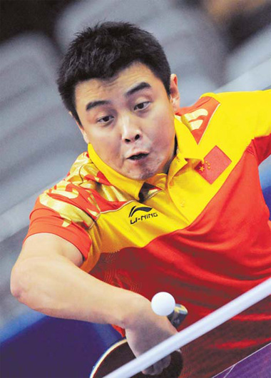Wang Hao of China returns a shot to Oh Sang-eun of the ROK during the table tennis men's team final in Guangzhou on Tuesday. Goh Chai Hin / Agence France-Presse