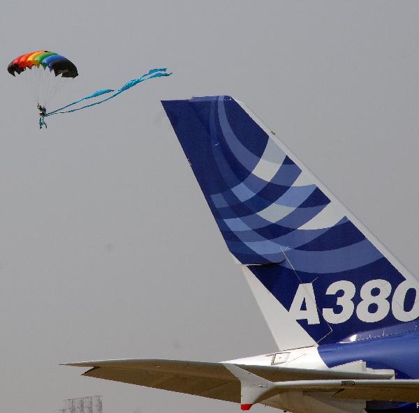 A member of the parachute team of the Air Force of the Chinese People&apos;s Liberation Army (PLA) performs during the 8th China International Aviation and Aerospace Exhibition in Zhuhai City, south China&apos;s Guangdong Province, Nov. 17, 2010. [Xinhua]