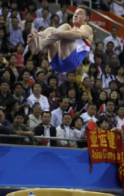 Kazakhstan&apos;s Stanislav Valiyev competes in the men&apos;s vault final during artistic gymnastics at the 16th Asian Games in Guangzhou, Guangdong province, November 17, 2010. [China Daily/Agencies]