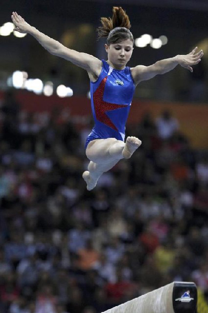 Uzbekistan&apos;s Luiza Galiulina competes in the women&apos;s balance beam final during artistic gymnastics at the 16th Asian Games in Guangzhou, Guangdong province, November 17, 2010. Galiulina received the bronze medal. [China Daily/Agencies] 