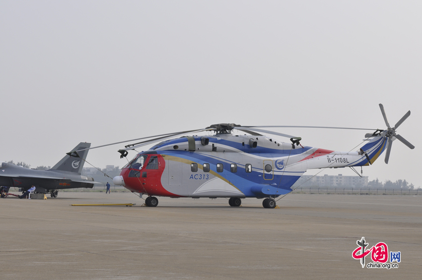 China&apos;s first domestically developed civilian helicopter AC 313, the latest showpiece of China&apos;s aerospace industry, lands in Zhuhai during the 8th China International Aviation and Aerospace Exhibition, South China&apos;s Guangdong province. The exhibition is open to the public from Nov. 16, 2010 to Nov. 21, 2010. [China.org.cn]