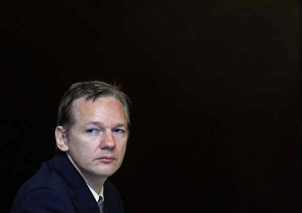 Wikileaks founder Julian Assange listens during a news conference on the internet release of secret documents about the Iraq War, in London October 23, 2010. [Xinhua]