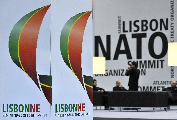 Logos of the Lisbon NATO summit are seen at the press center in Lisbon, capital of Portugal, on Nov. 18, 2010. The NATO summit will be held from Nov. 19 to 20 in Lisbon. [Wu Wei/Xinhua]