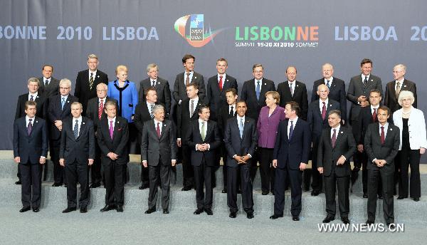 NATO leaders pose for a group photo at the venue of the NATO summit in Lisbon, capital of Portugal, Nov. 19, 2010. [Wang Qingqin/Xinhua]