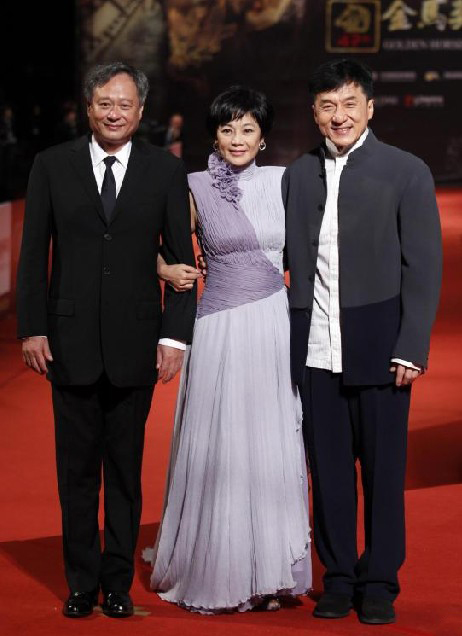 Directors Ang Lee, Sylvia Chang and actor Jackie Chan (L-R) pose on the red carpet at the 47th Golden Horse Film Awards in Taoyuan Nov 20, 2010. [China Daily/Agencies]