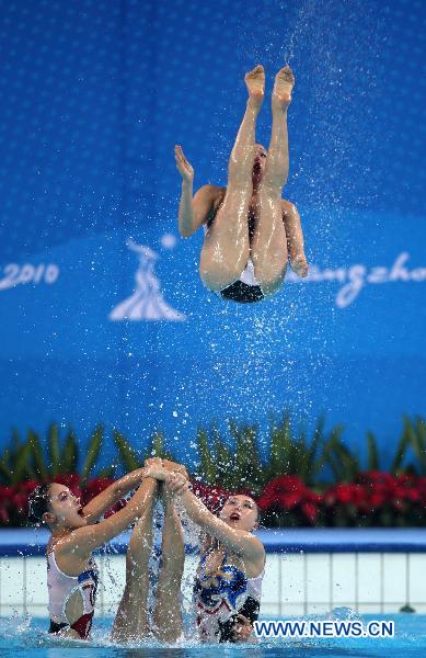 Team DPRK perform during the women's synchronised swimming team free routine final at the 16th Asian Games in Foshan, south China's Guangdong Province, Nov. 20, 2010. DPRK took the bronze with 173.000 points. (Xinhua/Fei Maohua) 
