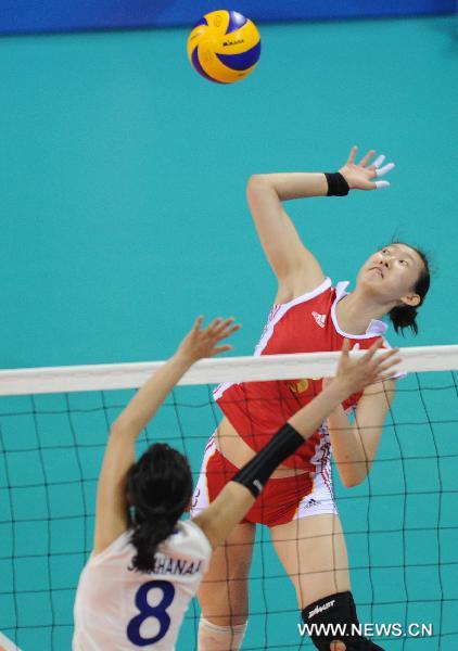 China's Yang Jie (R) spikes the ball during the women's volleyball Group A preliminary against Mongolia at the 16th Asian Games held in Guangzhou, capital of south China's Guangdong Province, Nov. 14, 2010. China won by 3-0. (Xinhua/Li Qiuchan) 