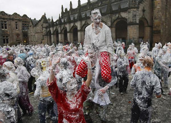 A student from St Andrews University takes part in a foam fight as part of the traditional Raisin Monday celebrations in St Andrews, Scotland November 22, 2010. [Xinhua/Reuters]