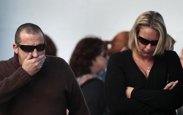 Family members of miners trapped underground in the Pike River coal mine leave a progress briefing by mine authorities and police in Greymouth on New Zealand&apos;s west coast Nov 23, 2010. [China Daily/Agencies]