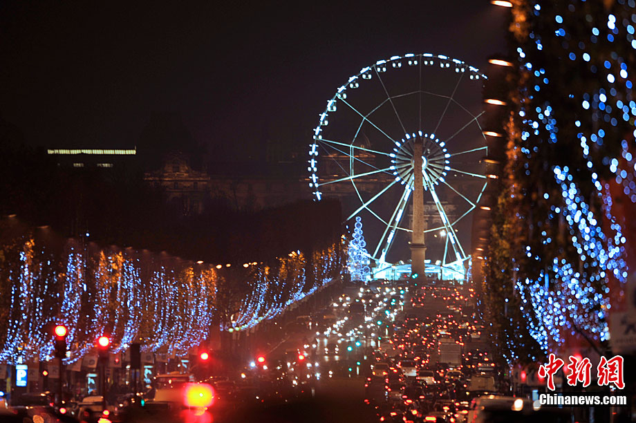 Paris&apos;s famous avenue, the Champs Elysees, was illuminated by Christmas lights on Monday, after they were switched on by the city&apos;s mayor Bertrand Delanoe, and actress Melanie Laurent. Flashing LED lights have been placed in the trees that line the famous avenue, creating a &apos;snowing&apos; effect. [Chinanews.com] 