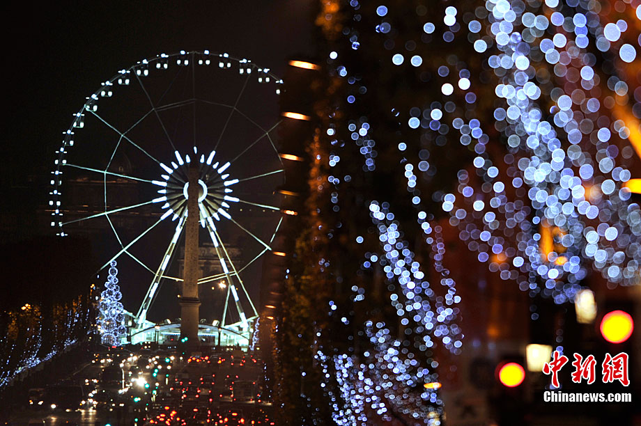 Paris&apos;s famous avenue, the Champs Elysees, was illuminated by Christmas lights on Monday, after they were switched on by the city&apos;s mayor Bertrand Delanoe, and actress Melanie Laurent. Flashing LED lights have been placed in the trees that line the famous avenue, creating a &apos;snowing&apos; effect. [Chinanews.com] 